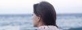 Woman looking out at the sea.