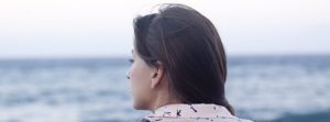 Woman looking out at the sea.