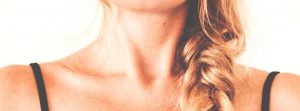 Close up of woman's collar's bones & neck muscles.