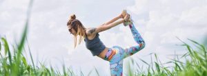 Woman stretching outside on a nice day.