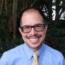 Tim Hirschman in blue shirt and yellow tie