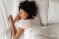 Woman sleeping in her bed.