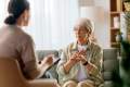 Elderly woman in counseling with femail therapist